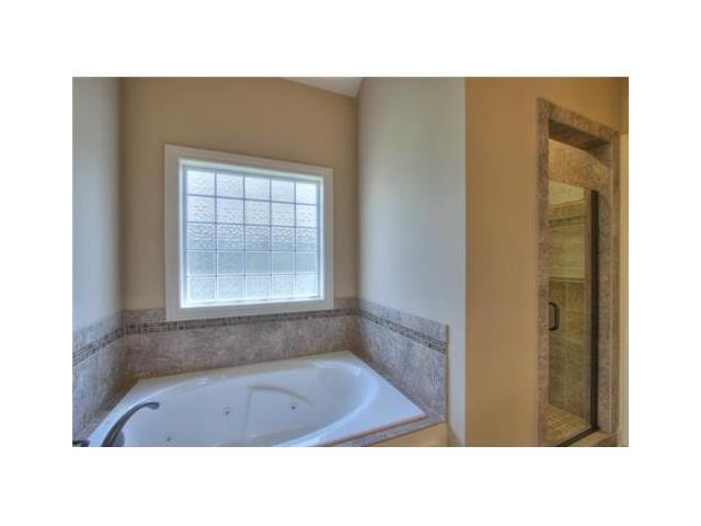 For Sale: 1694 NE Chapel Woods Dr Lees Summit, MO 64064